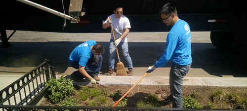 Volunteers clean a Gowanus Canal Conservancy bioswale