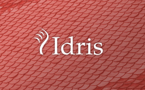 Idris logo overlaid on top of close-up dragon scales.