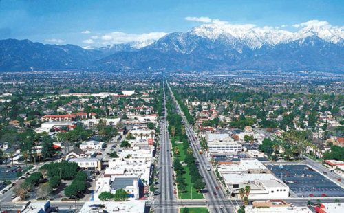 Photo of California roads and mountain range in the background.